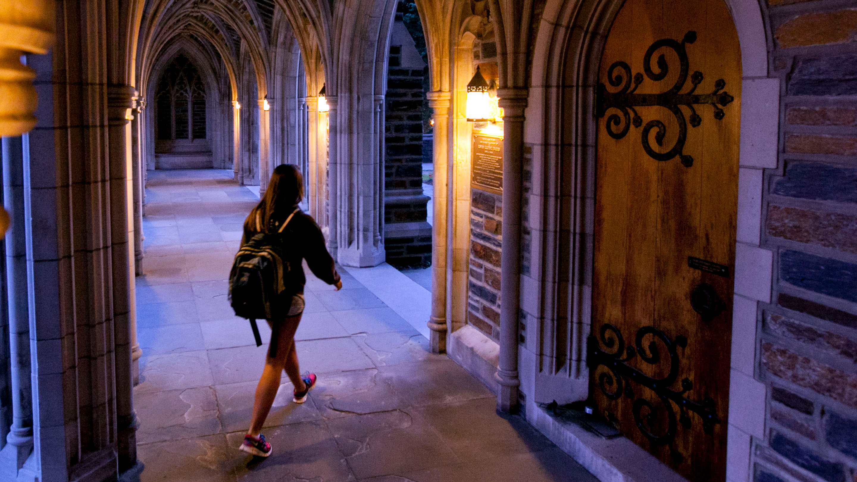 Student walking on Duke Campus