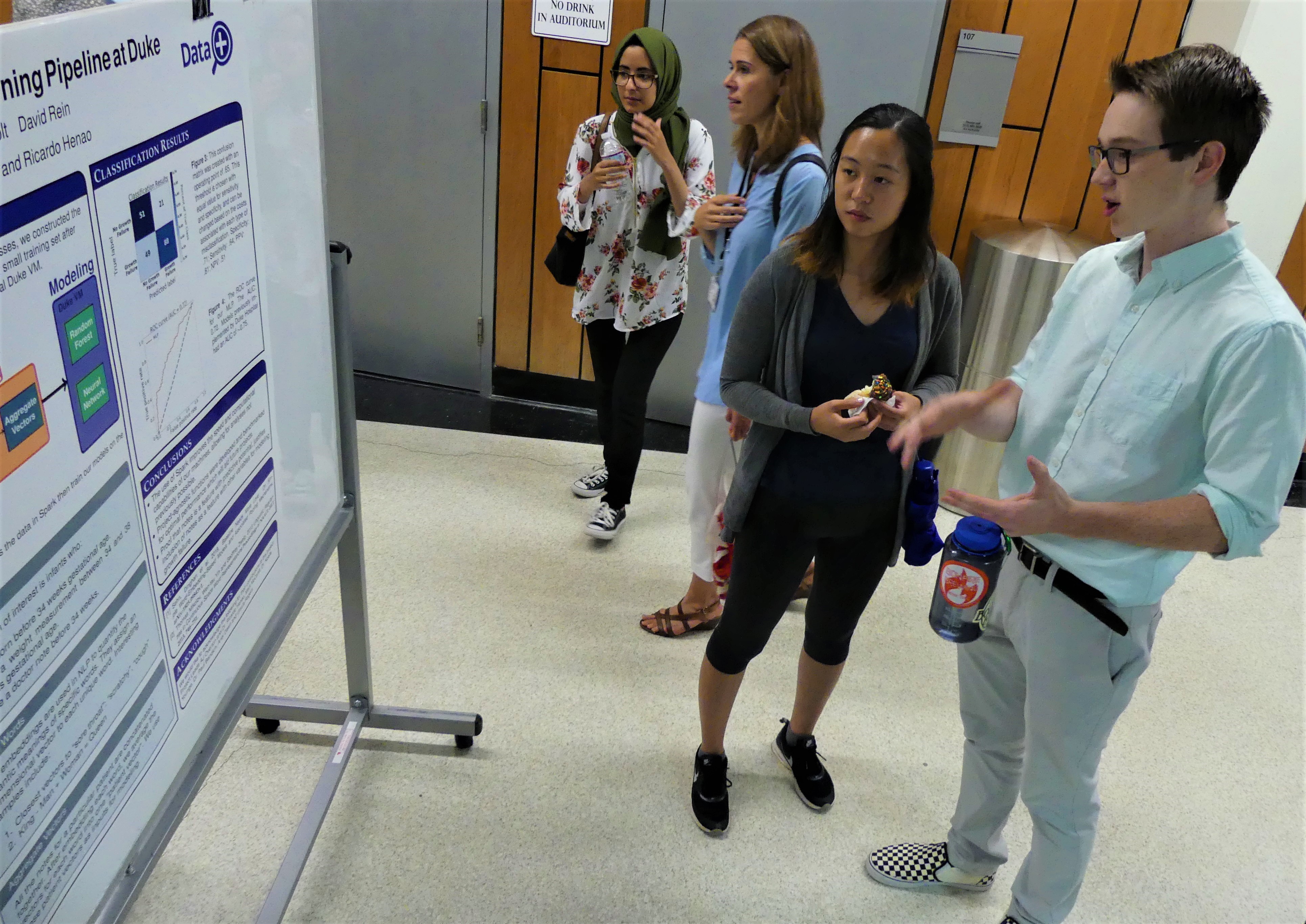 Data+ teams present posters detailing their work following their summer of research.