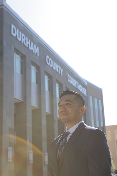 Arturo Nava stands in front of the Durham County Courthouse.