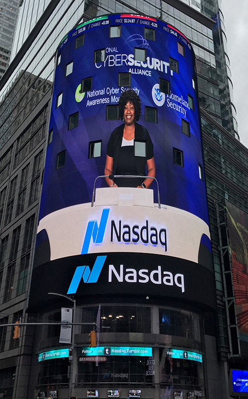 Valecia Maclin's image appears on the Nasdaq MarketSite in New York City.