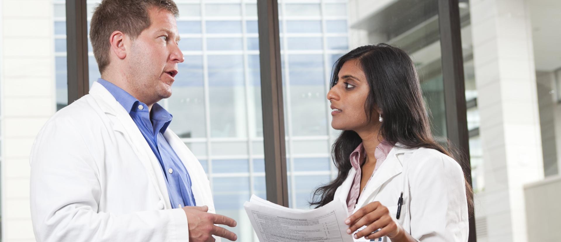 Duke neurologist Daniel Laskoqitz with a medical student.