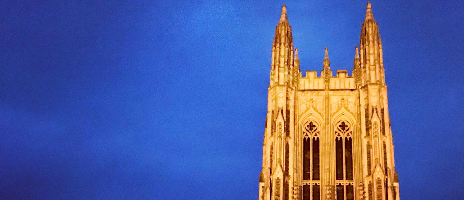 The outside view of the Duke Chapel with blue sky behind it