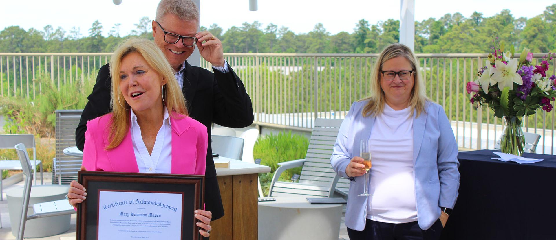 Mary (foreground) and Tim Mapes with Nicholas School dean Lori Bennear