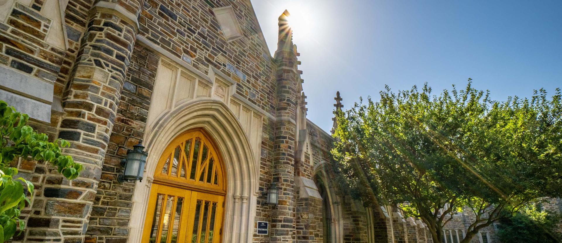 Photo shows the main door and the exterior of the Westbrook Building at Duke Divinity School.