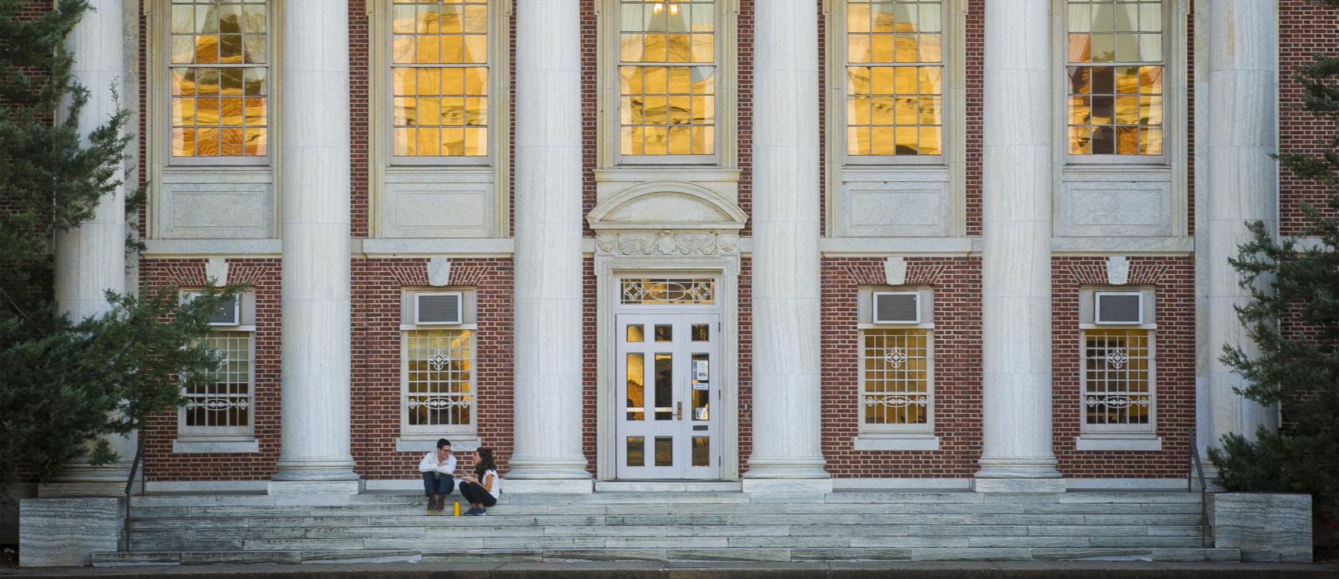 Students sit outside Lilly Library on Duke's East Campus.