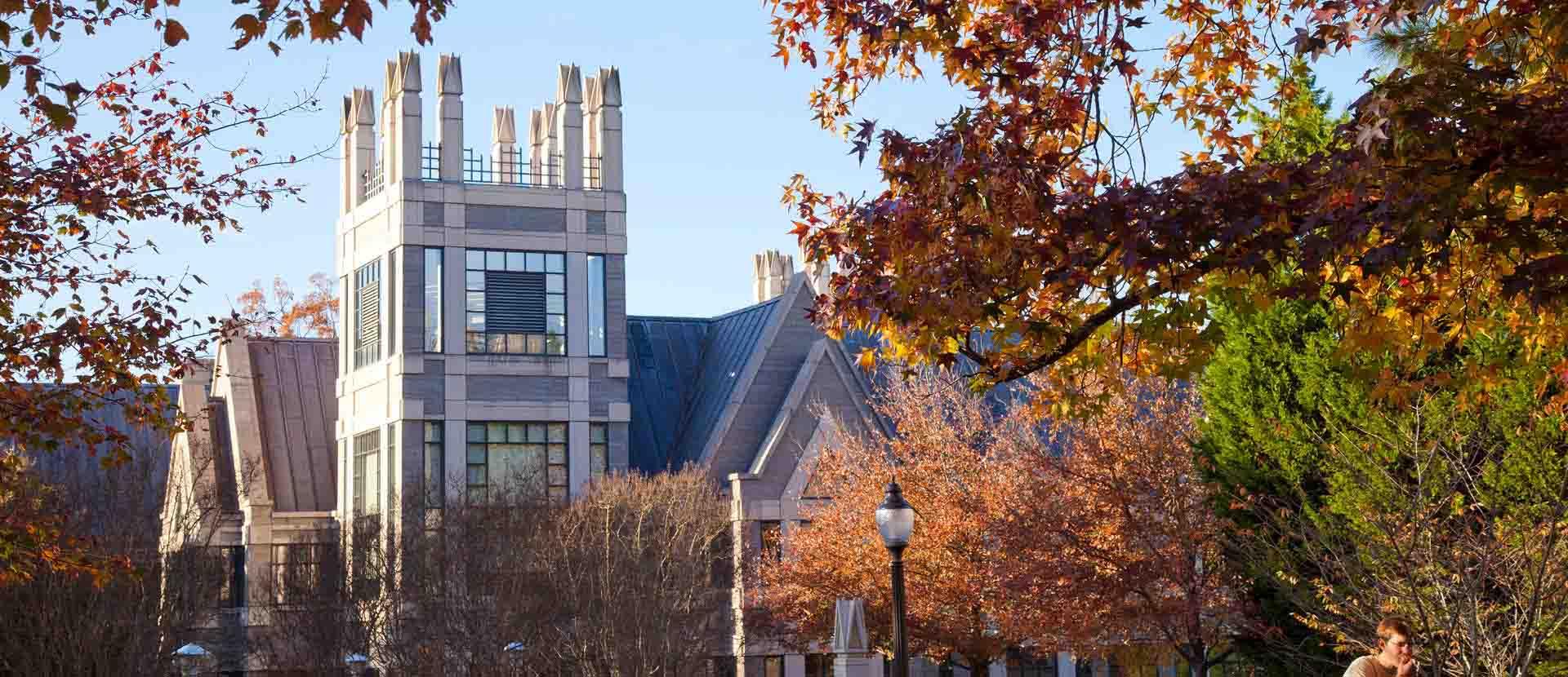 Fall foliage frames the Duke University's Sanford School of Public Policy.