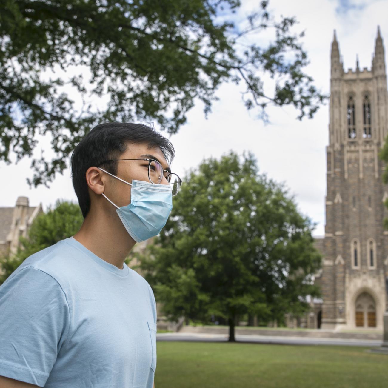 A student wears a face mask on Duke University's West Campus.