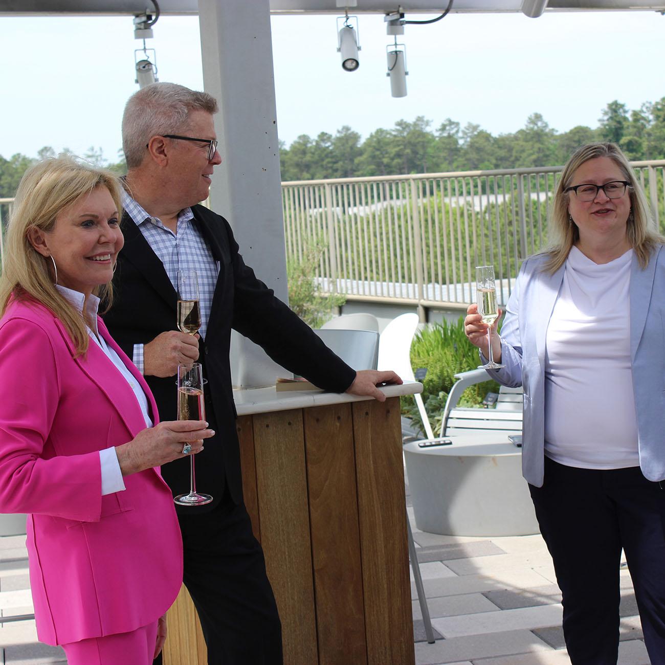 Mary (foreground) and Tim Mapes with Nicholas School dean Lori Bennear