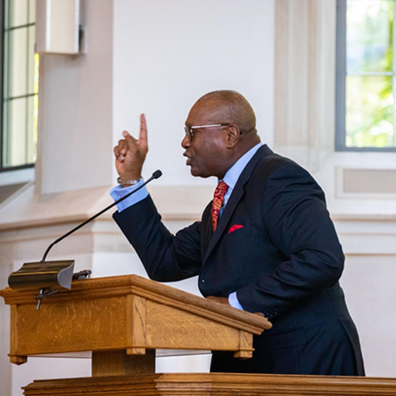 A preacher speaks from the pulpit in the Duke Divinity School chapel.
