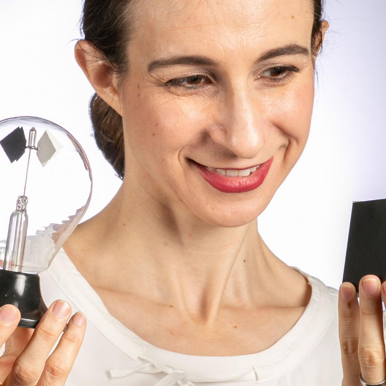 Cynthia Rudin holding a black box and light bulb