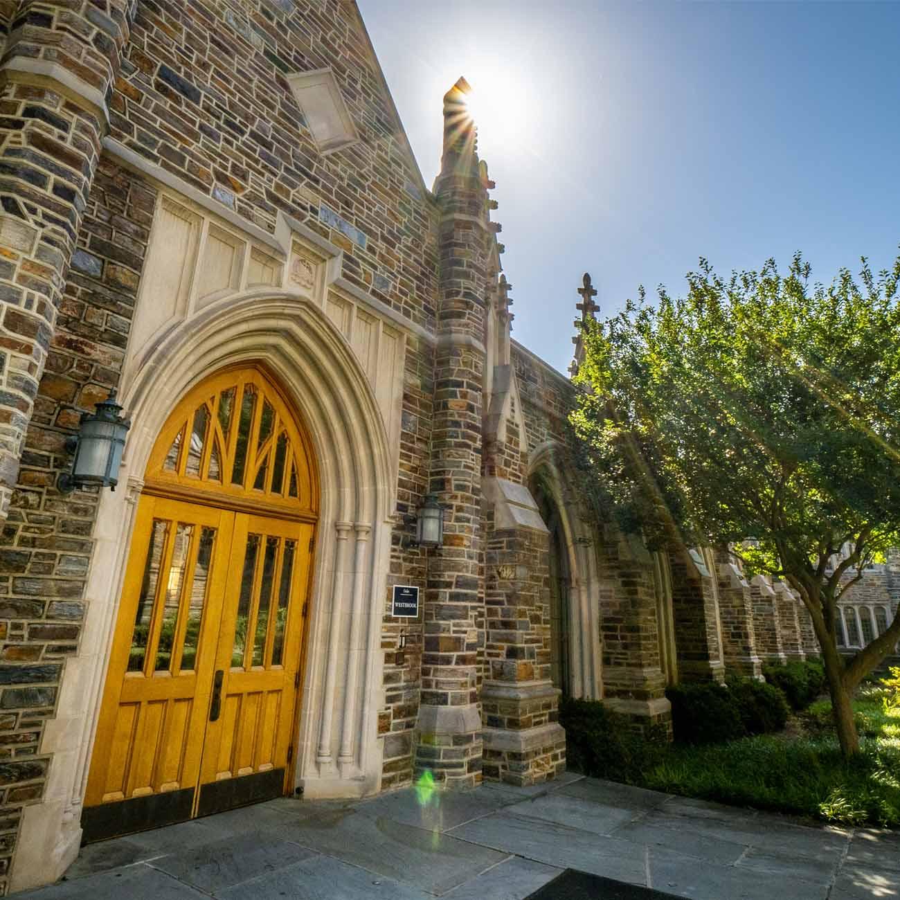 Photo shows the main door and the exterior of the Westbrook Building at Duke Divinity School.