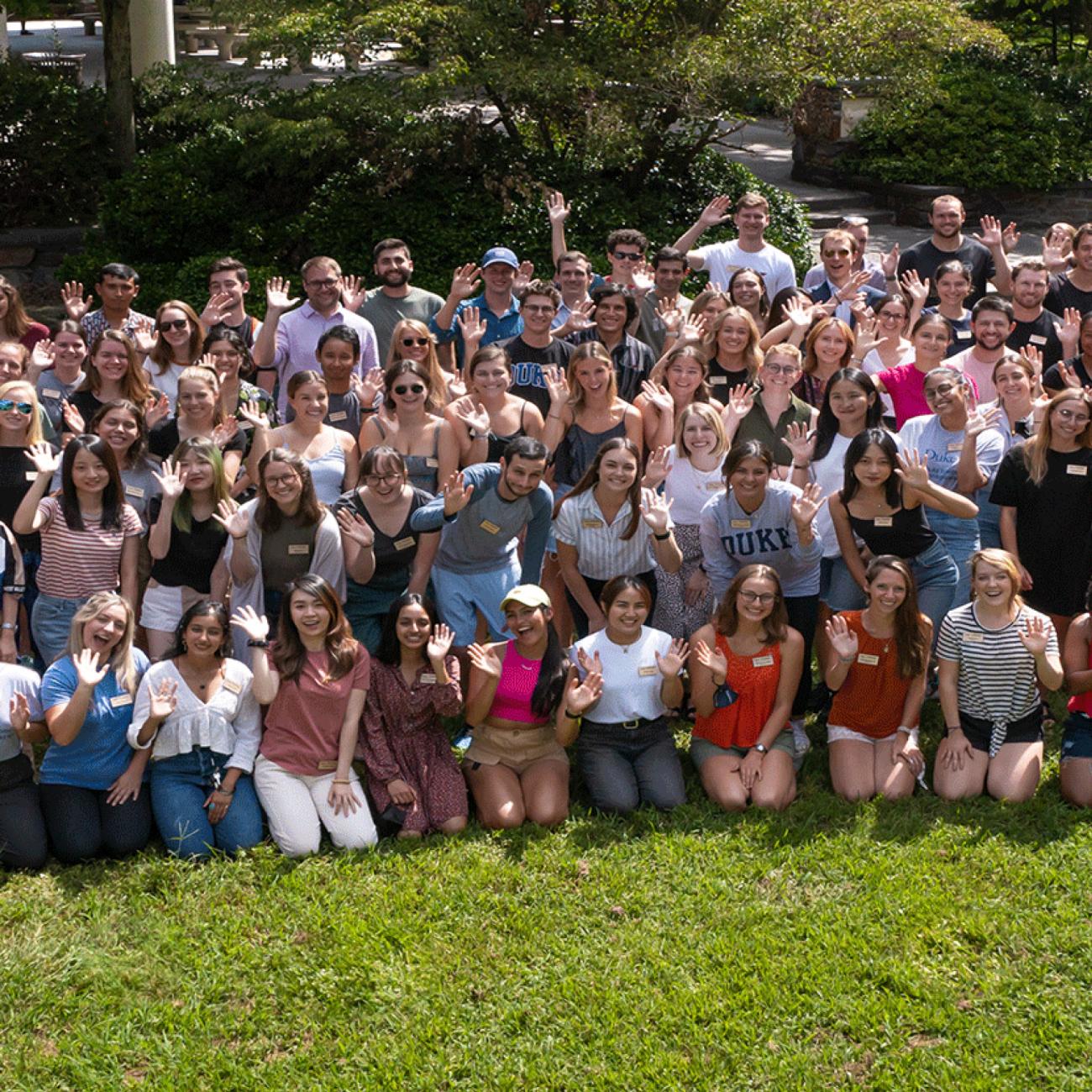 An outdoor photo of all the students, faculty and staff of the Nicholas School for the Environment gathered outside in the school's courtyard