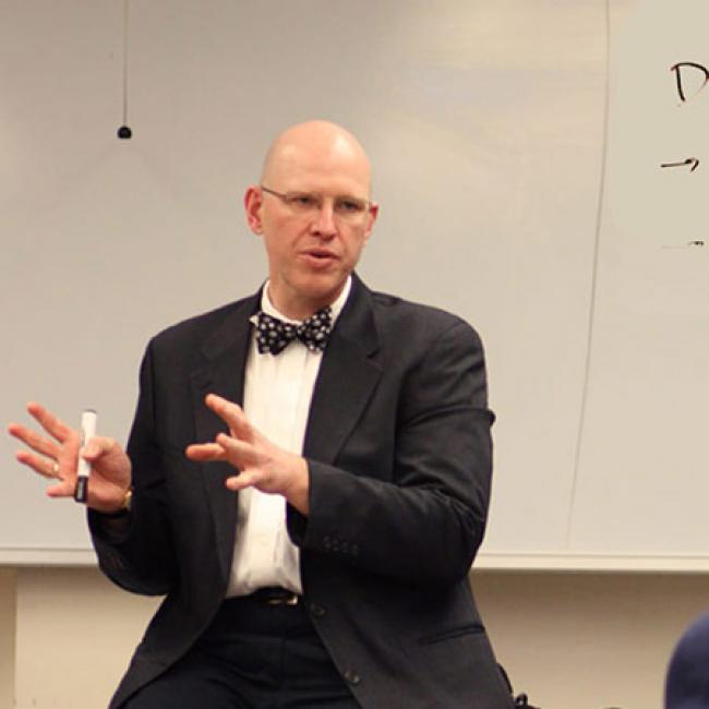 Connel Fullenkamp, professor of the practice of economics, teaches a classroom of undergraduates at Duke.